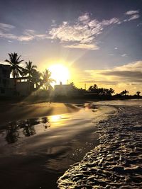 Scenic view of beach against sky during sunset