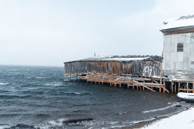 Scenic view of sea against sky during winter