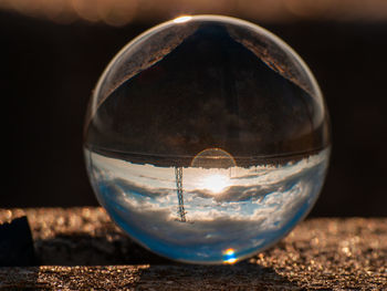 Close-up of crystal ball in glass