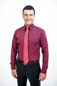 Portrait of a smiling young man against white background