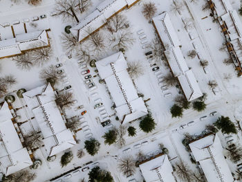 High angle view of snow covered trees on field