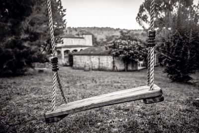 Wooden bench on grassy field