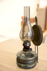 Close-up of glass bottle on table