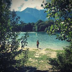 Man looking at view of lake