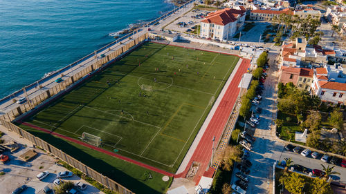 High angle view of buildings by sea