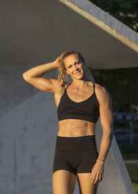 Smiling woman wearing fitness clothes