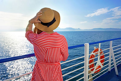 Cruise ship vacation holiday. rear view of relaxed stylish woman enjoying travel on cruise liner.