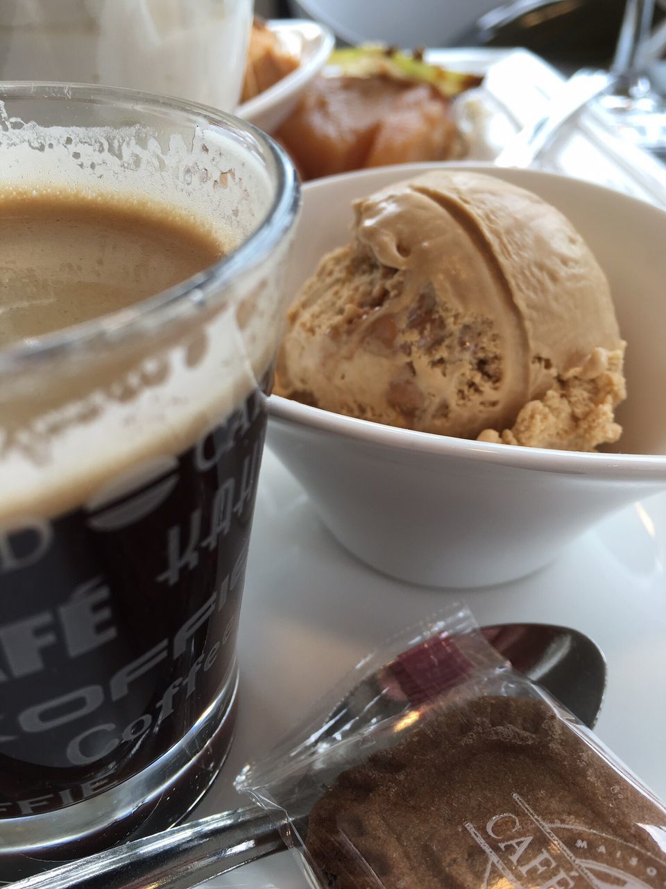 food and drink, indoors, drink, freshness, refreshment, still life, table, close-up, coffee cup, coffee - drink, food, text, focus on foreground, spoon, no people, selective focus, western script, healthy eating, high angle view, cup