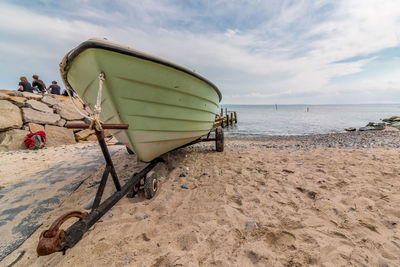 Boat on shore at beach