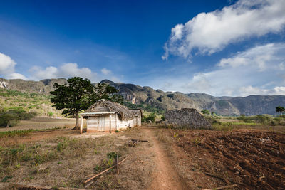 House on field against sky