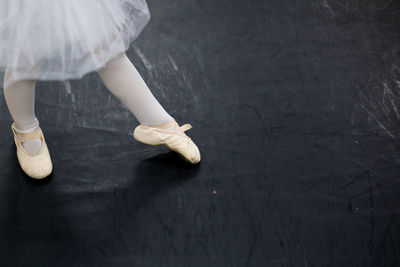 Low section of ballet dancer performing on stage