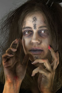 Close-up portrait of woman during halloween