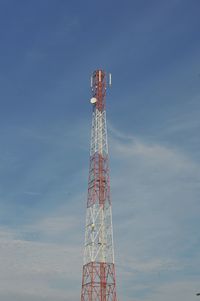 Low angle view of communications tower against sky