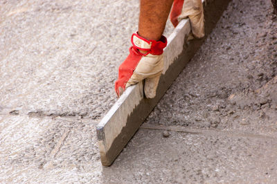 Low section of man working at construction site