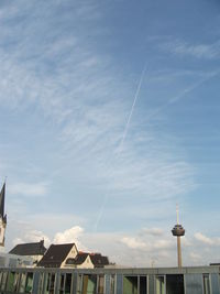 Low angle view of buildings against blue sky