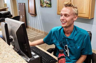 Portrait of smiling young man at home