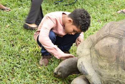 Side view of boy looking at camera