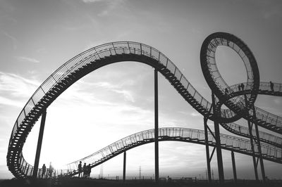 Low angle view of rollercoaster against sky