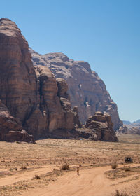 Rock formations in desert against clear sky