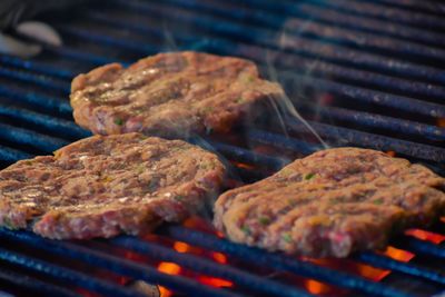 Close-up of meat on barbecue grill