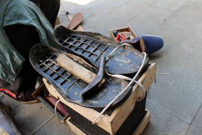 Low section of man wearing shoes on street