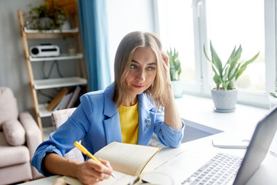 Young woman working at office