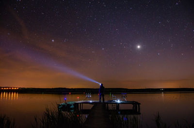 Scenic view of sea against sky at night