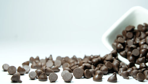 Close-up of coffee beans against white background