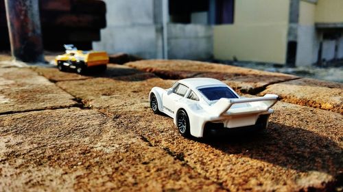 Close-up of toy car on street