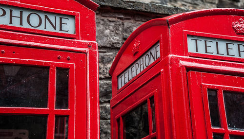 Close-up of red telephone booth in city