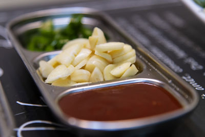 High angle view of chopped garlic , chili and red-chili pepper sauce in bowl