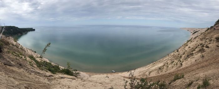 Panoramic view of land and mountains against sky