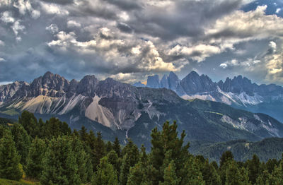 Idyllic shot of mountains against cloudy sky