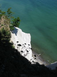 High angle view of rocks by sea