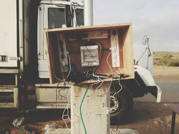 Close-up of abandoned meter box on pole