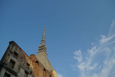 Low angle view of building against blue sky