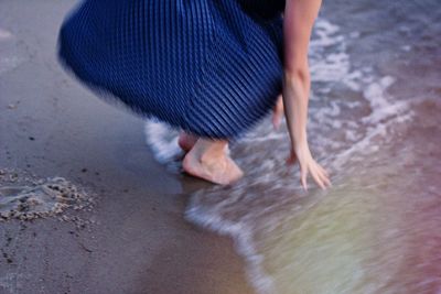 Woman standing on beach