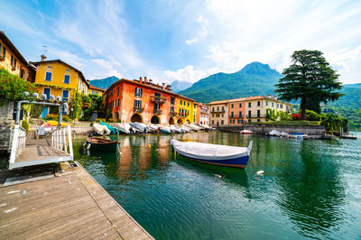 The town of mandello del lario, on lake como, the small port, the houses and the lake.