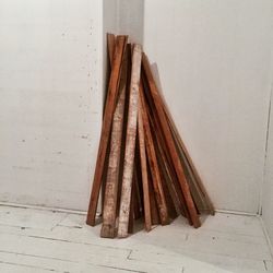 Wooden planks leaning against floor at home