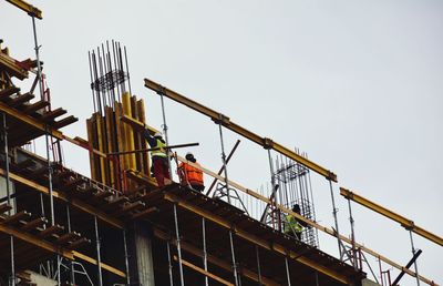 Low angle view of construction site against clear sky