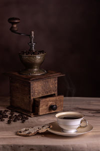 Close-up of coffee cup on table