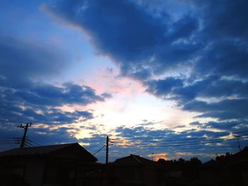 Low angle view of silhouette buildings against sky during sunset