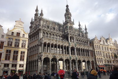 Group of people in front of historic building