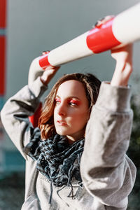 Close-up of young woman hanging outdoors