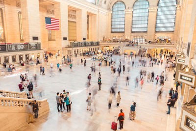 High angle view of people walking in front of building