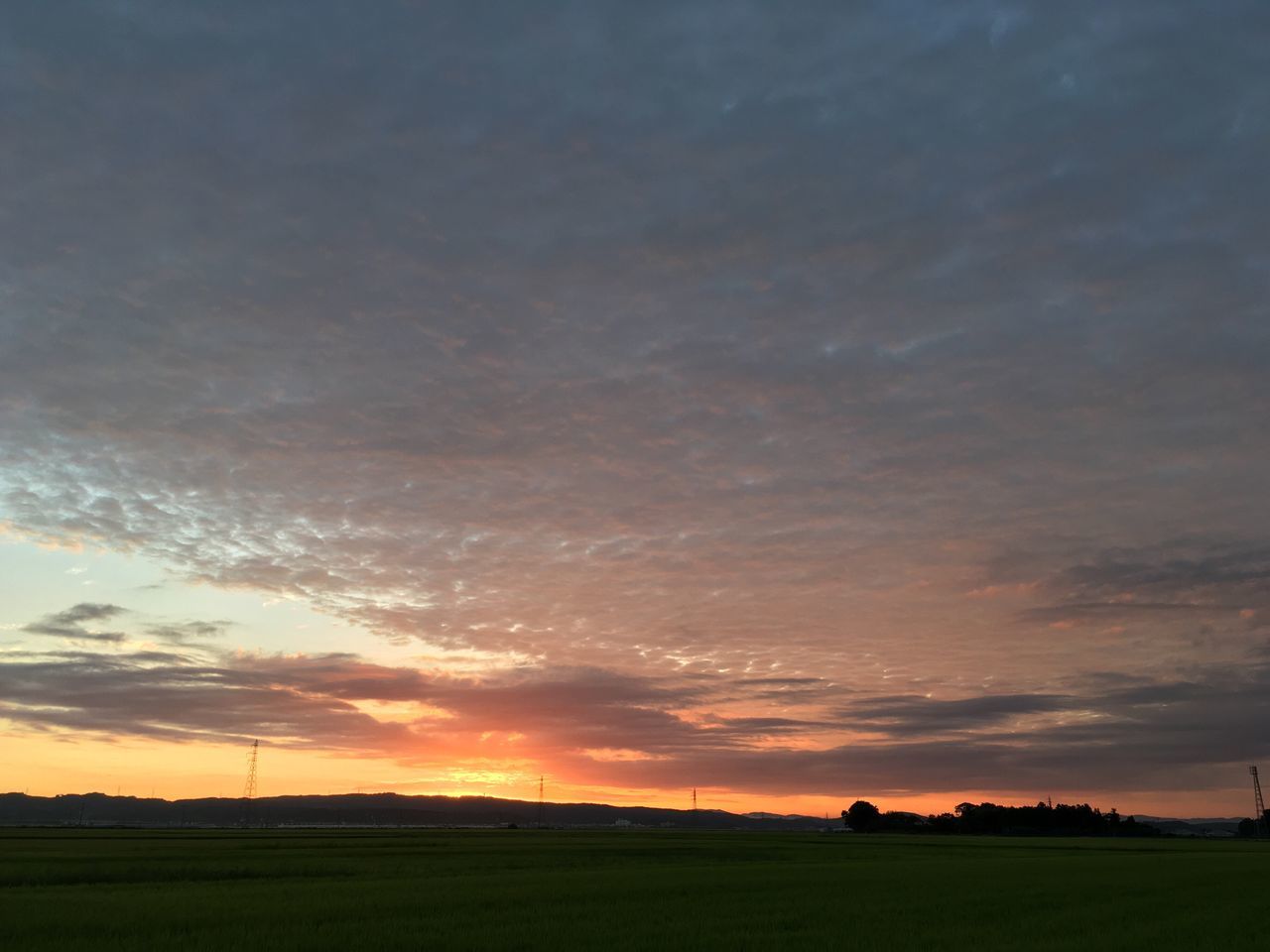 landscape, sunset, tranquil scene, scenics, tranquility, sky, beauty in nature, field, rural scene, nature, agriculture, cloud, orange color, majestic, outdoors, farm, non-urban scene, cloud - sky, countryside, remote, solitude, no people, dramatic sky, cultivated land, atmospheric mood