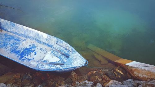 Close-up high angle view of boat at riverbank