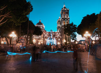 Illuminated buildings in city at night