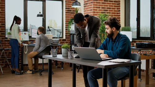 Business colleagues working at office