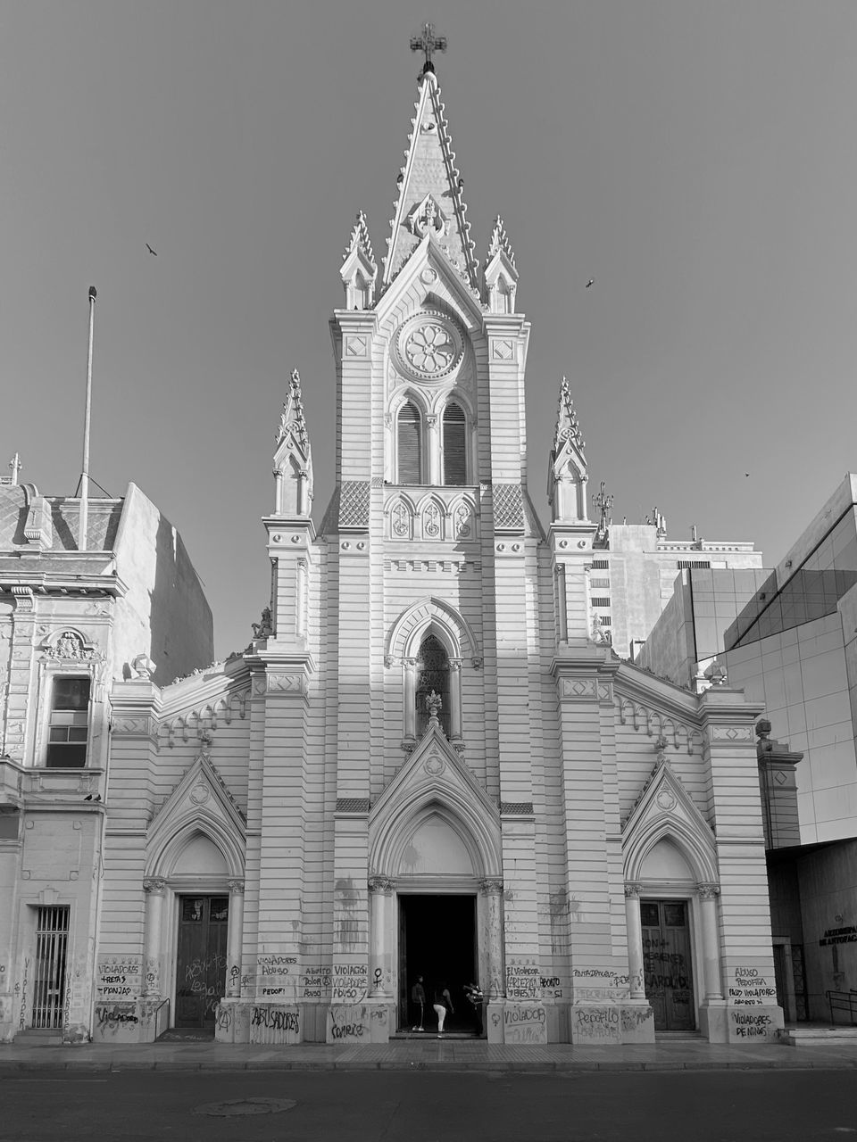 FACADE OF TEMPLE AGAINST BUILDING